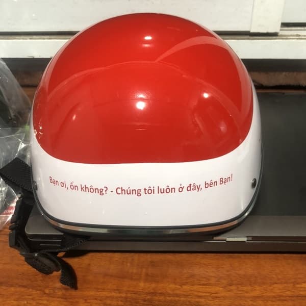 Mũ bảo hiểm in logo ActionAid