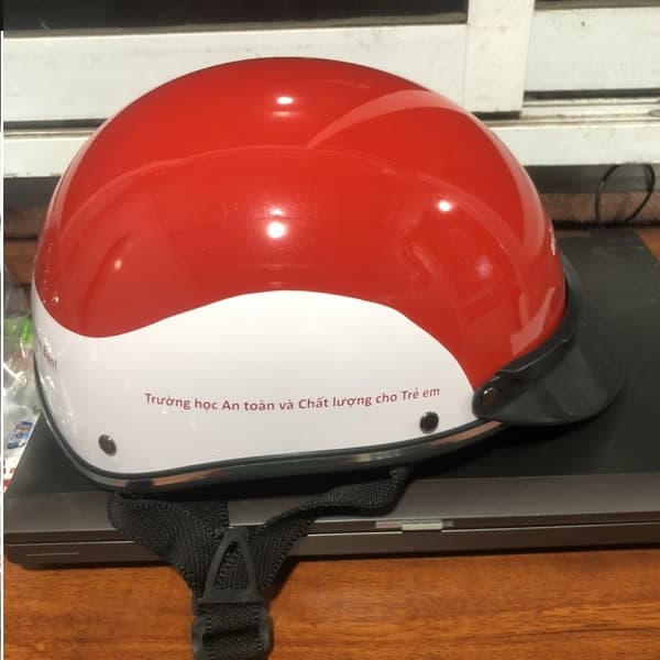 Mũ bảo hiểm in logo ActionAid